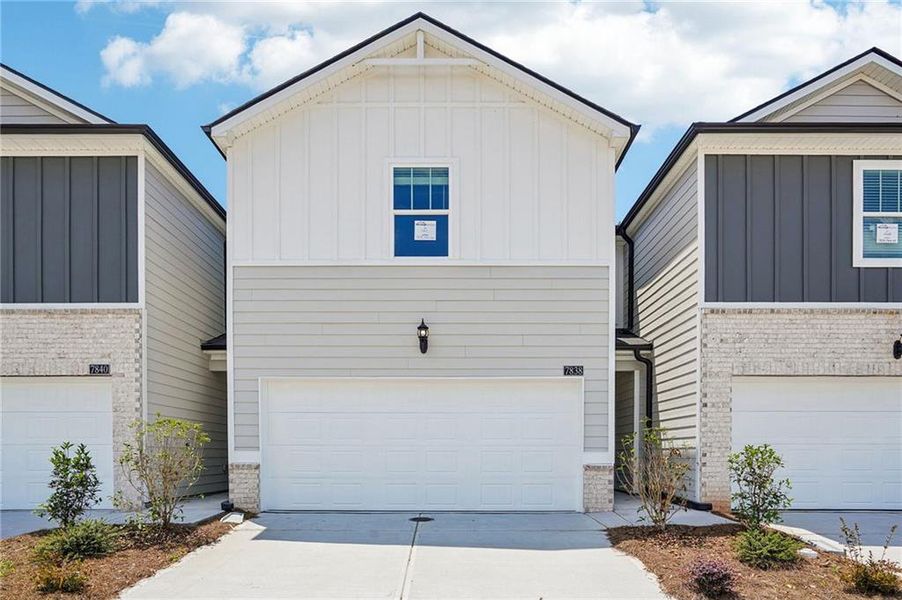 Front exterior of a new home in Artisan Walk, Fairburn, GA, highlighting curb appeal (Image 22).