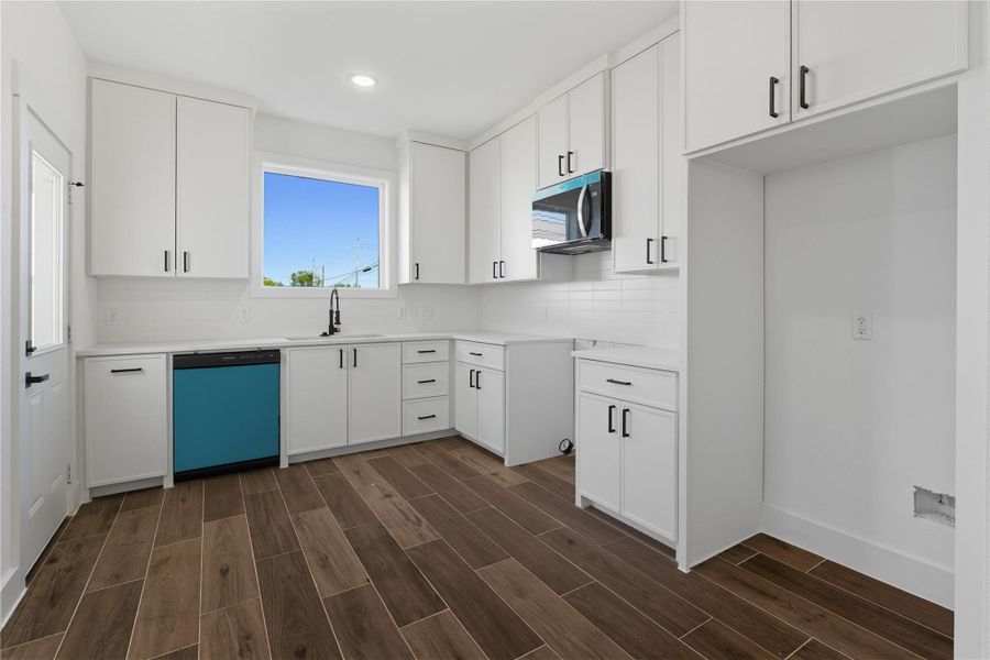 The kitchen is brand new and designed with both style and function in mind. Bright white cabinetry with gold hardware offers plenty of storage, while the modern subway tile backsplash adds a sleek touch. All-new stainless steel appliances, including a gas range and microwave, make your cooking a breeze. The open layout connects easily to the dining and living areas, creating the perfect space for entertaining or everyday meals.” The kitchen is brand new and designed with both style and function in mind. Bright white cabinetry with gold hardware offers plenty of storage, while the modern subway tile backsplash adds a sleek touch. All-new stainless steel appliances, including a gas range and microwave, make your cooking a breeze. The open layout connects easily to the dining and living areas, creating the perfect space for entertaining or everyday meals.”