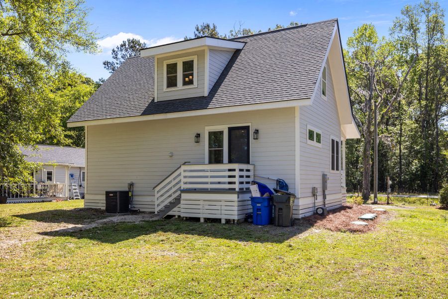 Exterior details and patio area of a home in , Johns Island (Image 27).