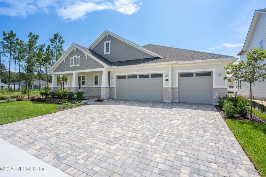 Front exterior of a new home in SilverLeaf, St. Augustine, FL, highlighting curb appeal (Image 25). Front exterior of a new home in SilverLeaf, St. Augustine, FL, highlighting curb appeal (Image 25).