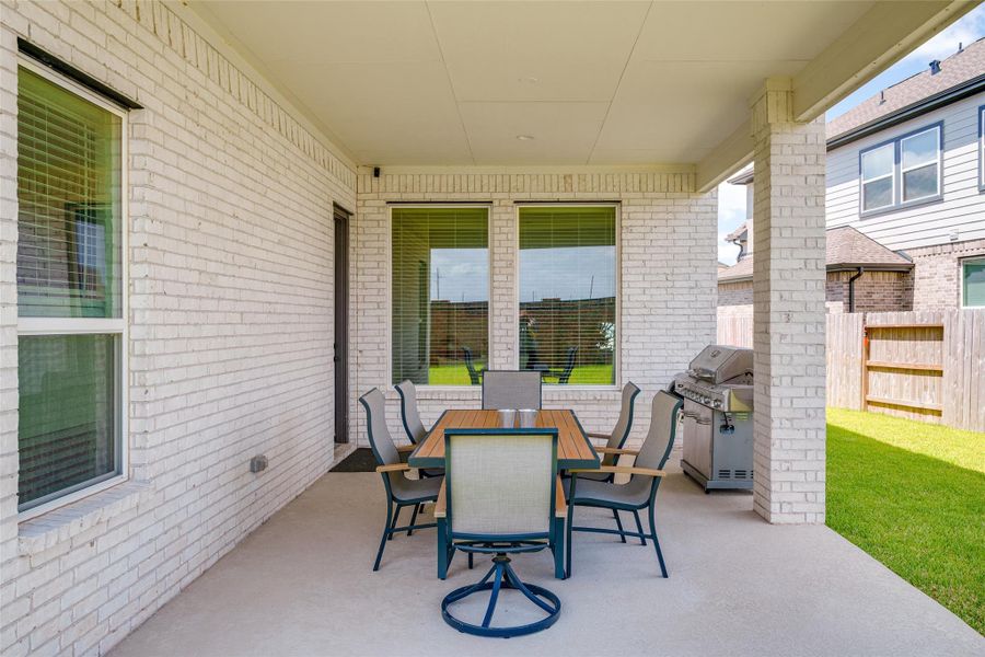 The backyard features an upgraded covered patio, perfect for outdoor relaxation and entertaining. The backyard features an upgraded covered patio, perfect for outdoor relaxation and entertaining.