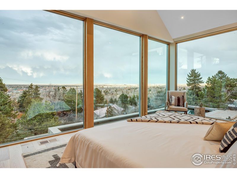 Primary bedroom overlooking patio / pool / spa