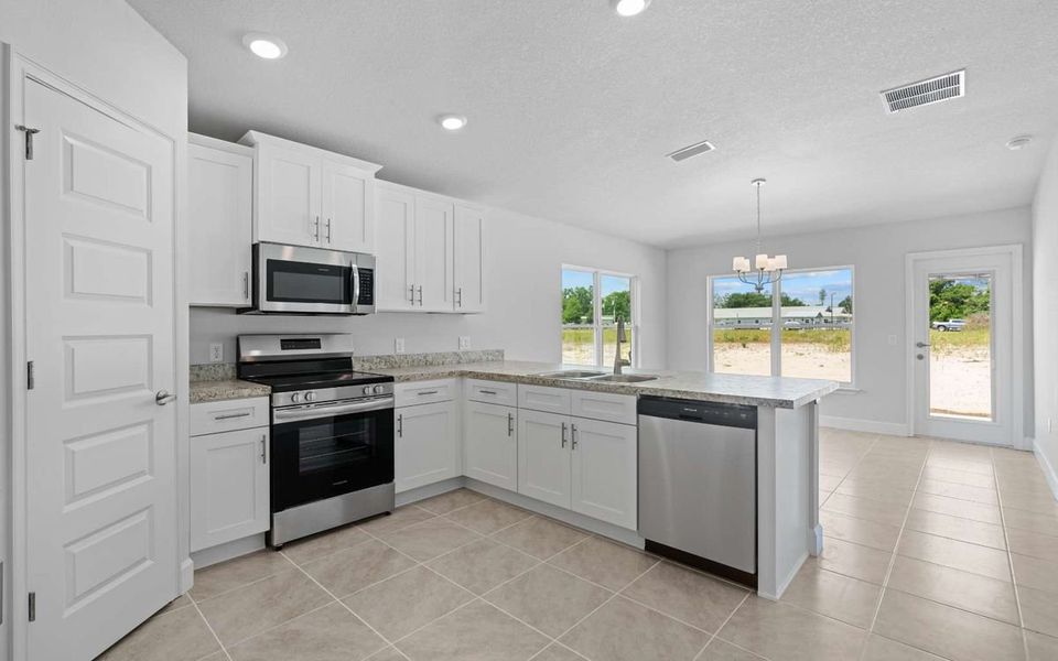 Representative furnished interior of a home built from the Plan 1539 by Adams Homes in Rolling Hills, Bell (Image 5). Representative furnished interior of a home built from the Plan 1539 by Adams Homes in Rolling Hills, Bell (Image 5).