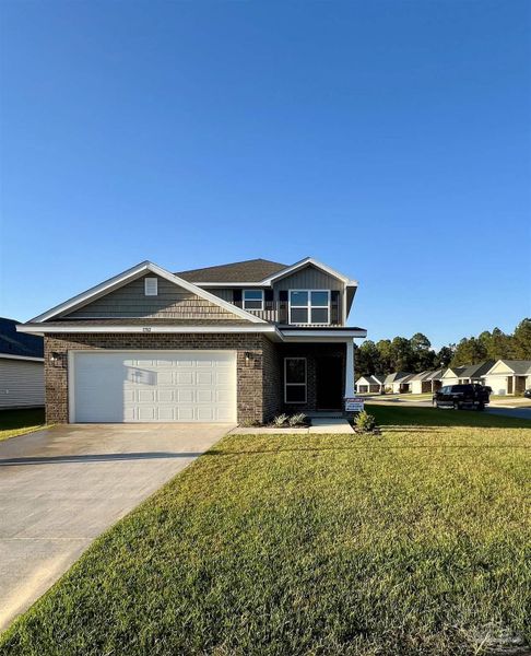 Front exterior of a new home in Allison Acres, Cantonment, FL, highlighting curb appeal (Image 1).