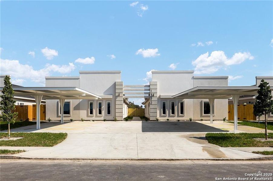 Front exterior of a new home in , Weslaco, TX, highlighting curb appeal (Image 1).