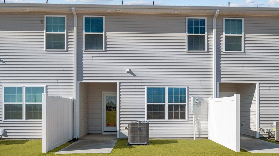 Exterior details and patio area of a home in The Townes at Ridgewood Farms, Winterville (Image 4).