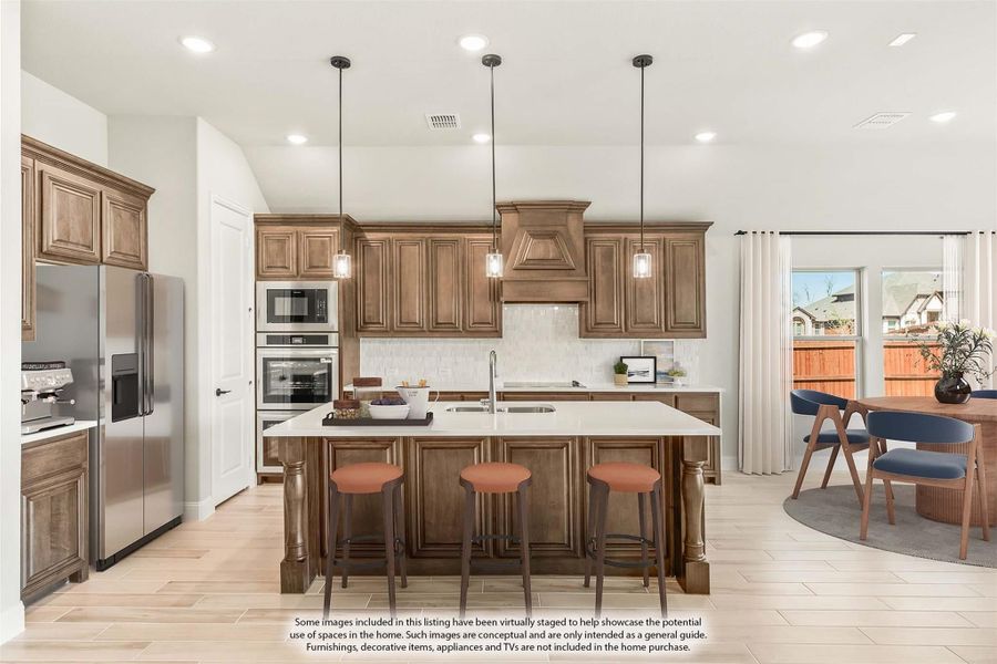 Kitchen with brown wood cabinets, large island with three stools, pendant lights, and stainless steel appliances Kitchen with brown wood cabinets, large island with three stools, pendant lights, and stainless steel appliances