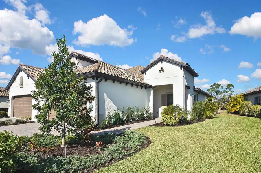 Front exterior of a new home in , Englewood, FL, highlighting curb appeal (Image 22).