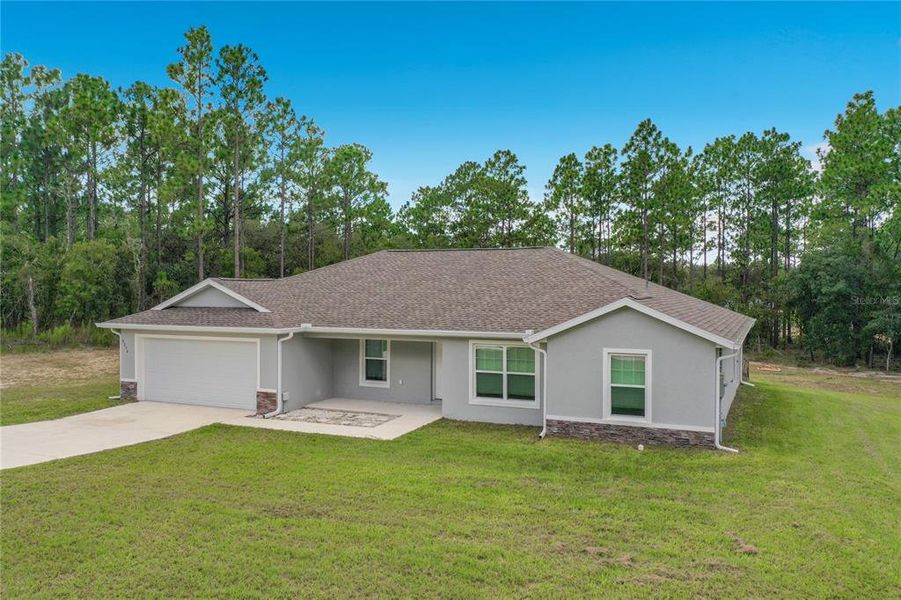 Front exterior of a new home in , Dunnellon, FL, highlighting curb appeal (Image 27).