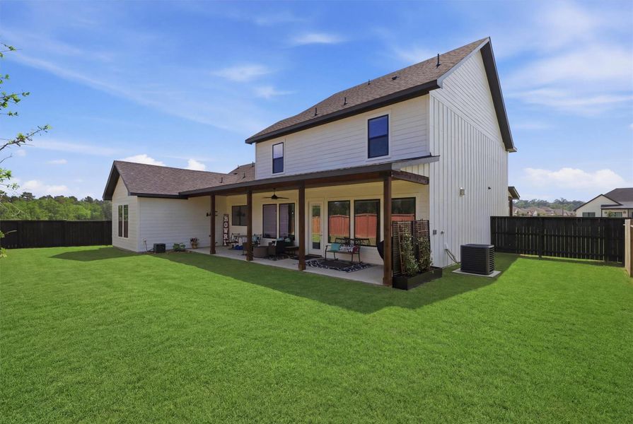 Exterior details and patio area of a home in Magnolia Woods - 70', Magnolia (Image 26).