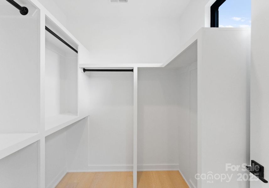 Primary walk-in closet.