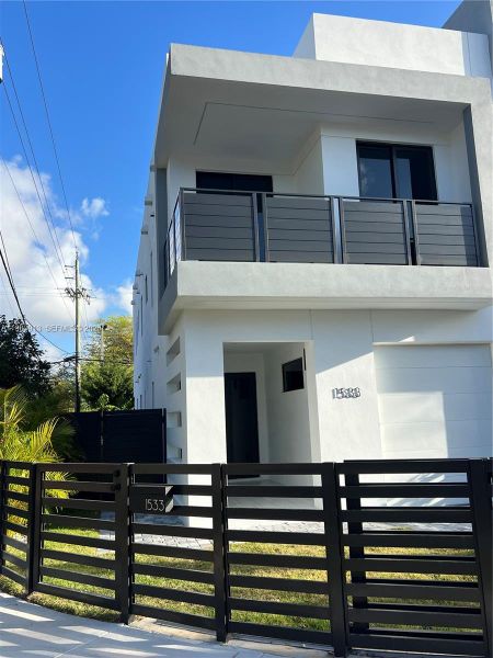 Front exterior of a new home in , Miami, FL, highlighting curb appeal (Image 1). Front exterior of a new home in , Miami, FL, highlighting curb appeal (Image 1).