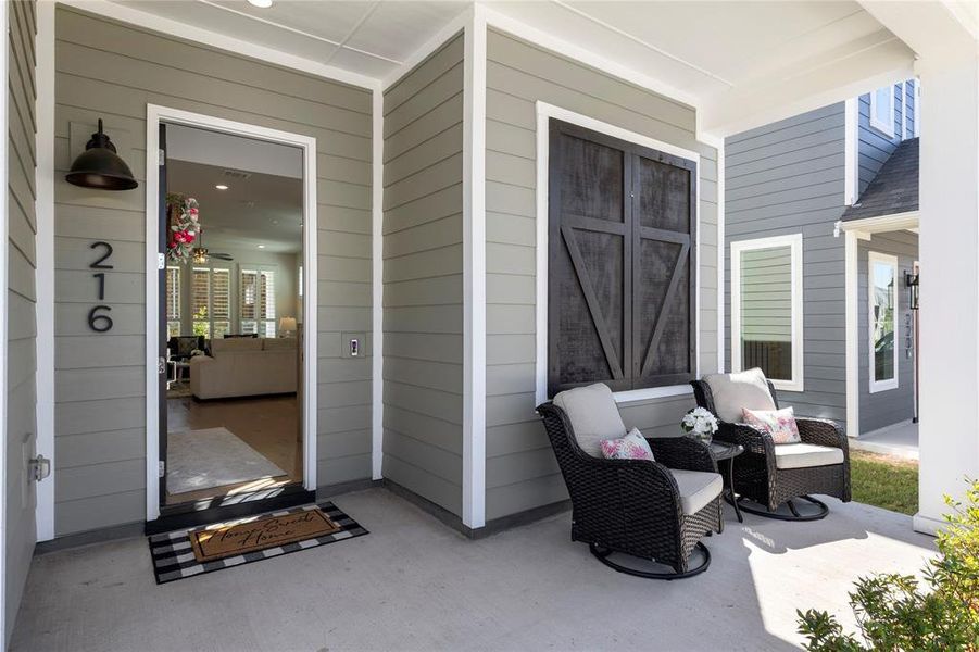 Exterior details and patio area of a home in North Square at Uptown, Celina (Image 27).