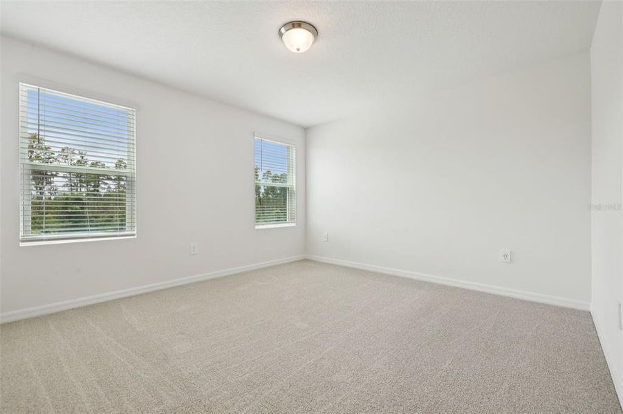 Spacious, unfurnished interior of a new home in Cagan Crossings West, Clermont (Image 26).