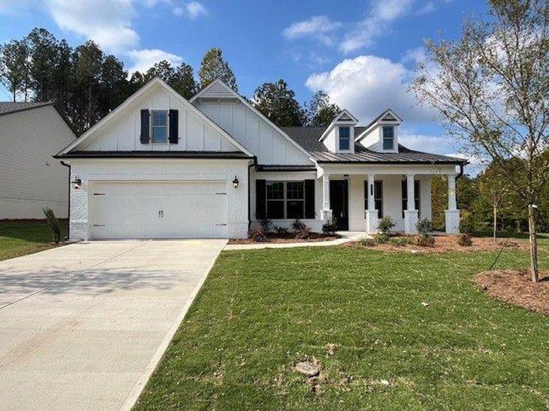 Front exterior of a new home in Soleil Belmont Park, Canton, GA, highlighting curb appeal (Image 1). Front exterior of a new home in Soleil Belmont Park, Canton, GA, highlighting curb appeal (Image 1).