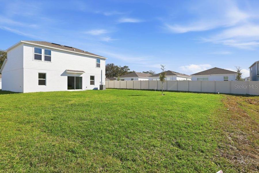 Exterior details and patio area of a home in Palm Wind, Hudson (Image 3).