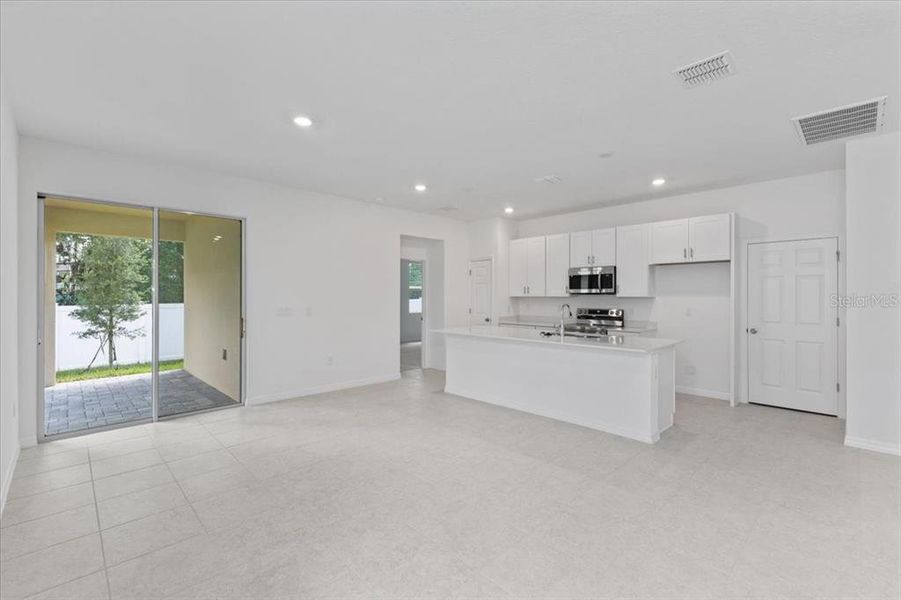 Furnished interior view inside a new home in Mirror Lake Village, Fruitland Park (Image 5).