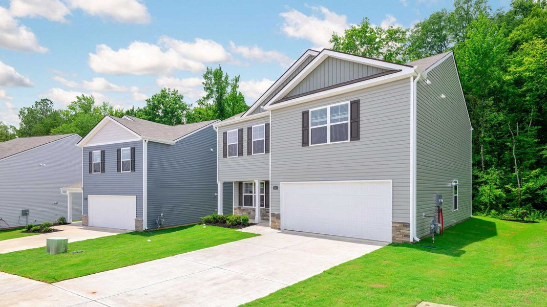 Front exterior of a new home in Hawk's Ridge, Rossville, GA, highlighting curb appeal (Image 21).