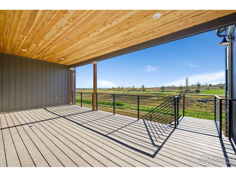 Exterior details and patio area of a home in The Fairways at RainDance, Windsor (Image 14).