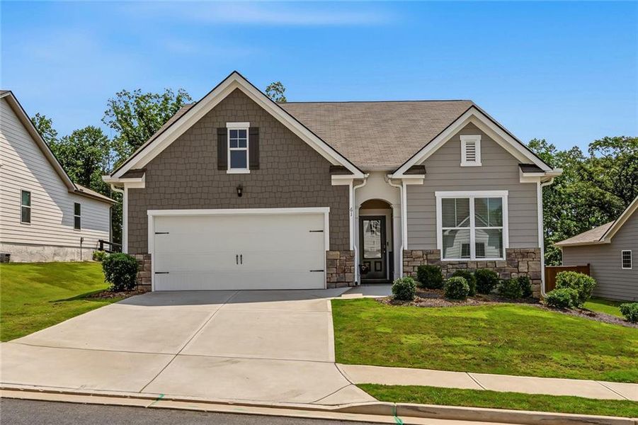 Front exterior of a new home in Lost Creek, Dallas, GA, highlighting curb appeal (Image 2). Front exterior of a new home in Lost Creek, Dallas, GA, highlighting curb appeal (Image 2).