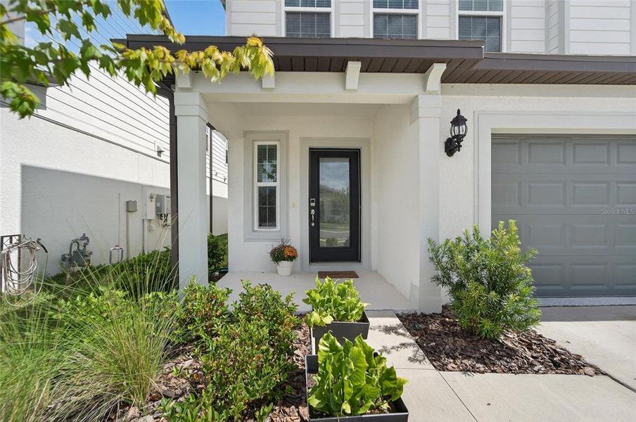 Exterior details and patio area of a home in Waterset, Apollo Beach (Image 24).