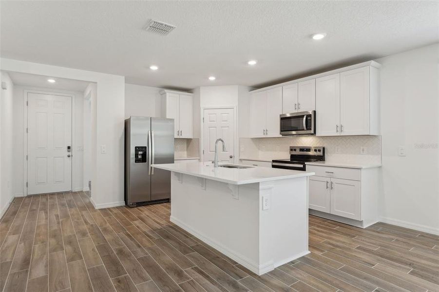 Furnished interior view inside a new home in Lawson Dunes - Signature Series, Haines City (Image 28).