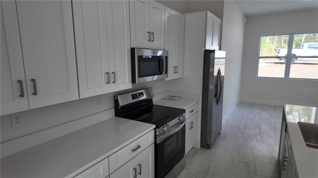 Furnished interior view inside a new home in , Dunnellon (Image 8).