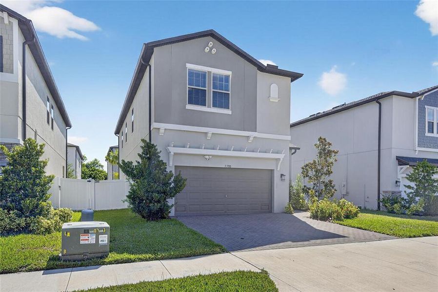 Front exterior of a new home in , Tampa, FL, highlighting curb appeal (Image 23).