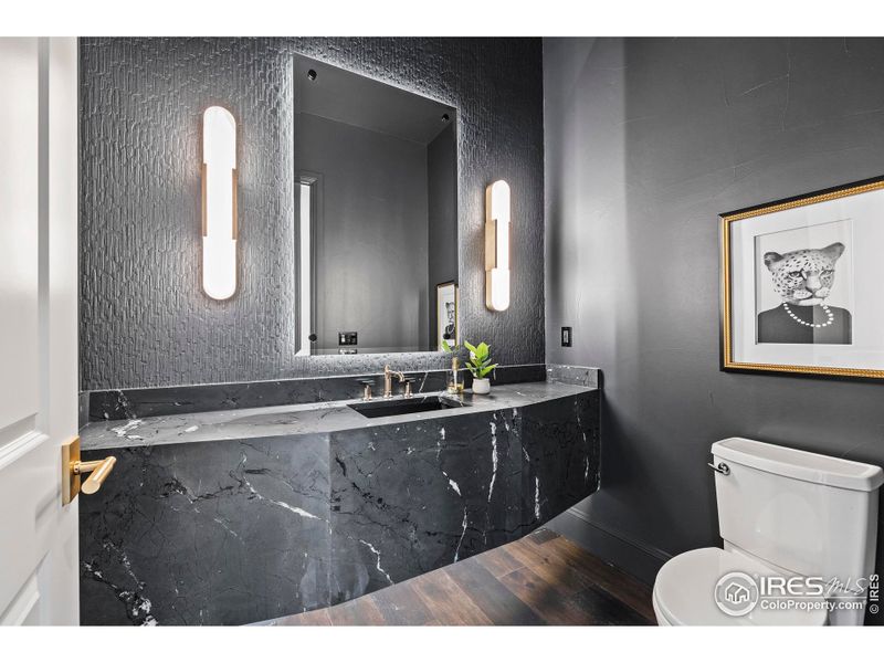 Powder baths throughout feature soapstone, quartz, under cabinet/custom lighting, and wallpaper