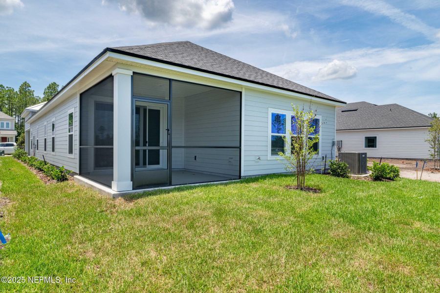 Front exterior of a new home in Beacon Lake, St. Augustine, FL, highlighting curb appeal (Image 32).