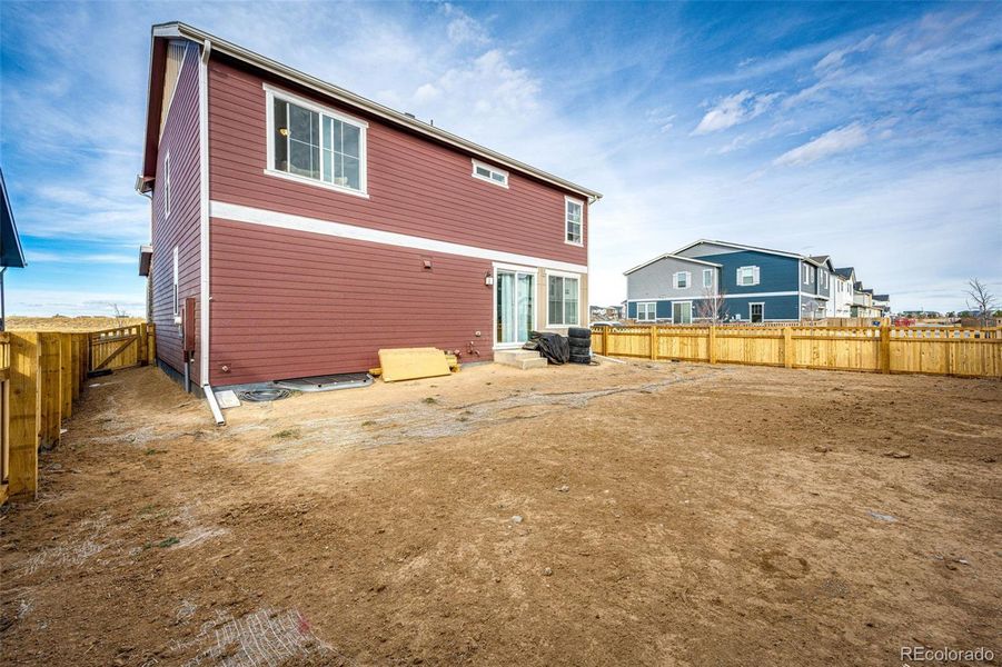 Exterior details and patio area of a home in Painted Prairie, Aurora (Image 23).