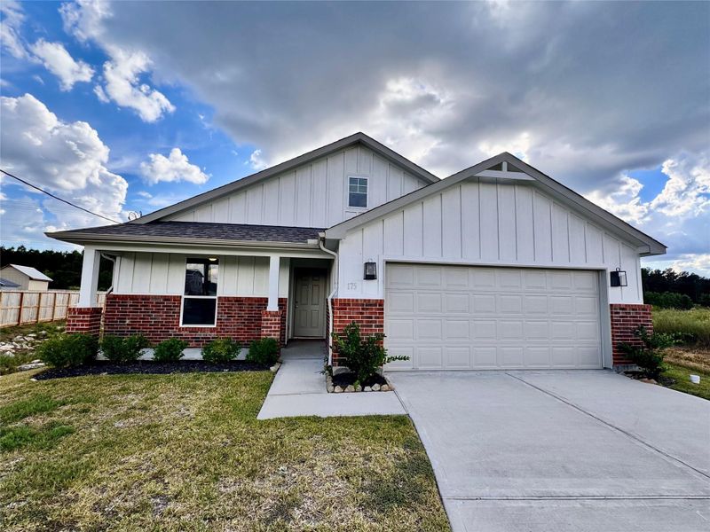 Front exterior of a new home in , Cleveland, TX, highlighting curb appeal (Image 1).