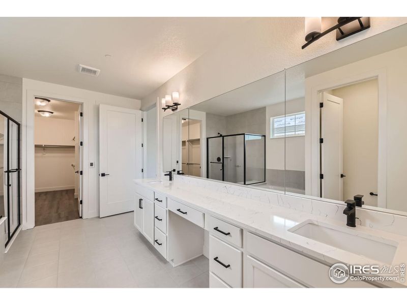 Master bathroom has a heated tile floor, big shower + bathtub.