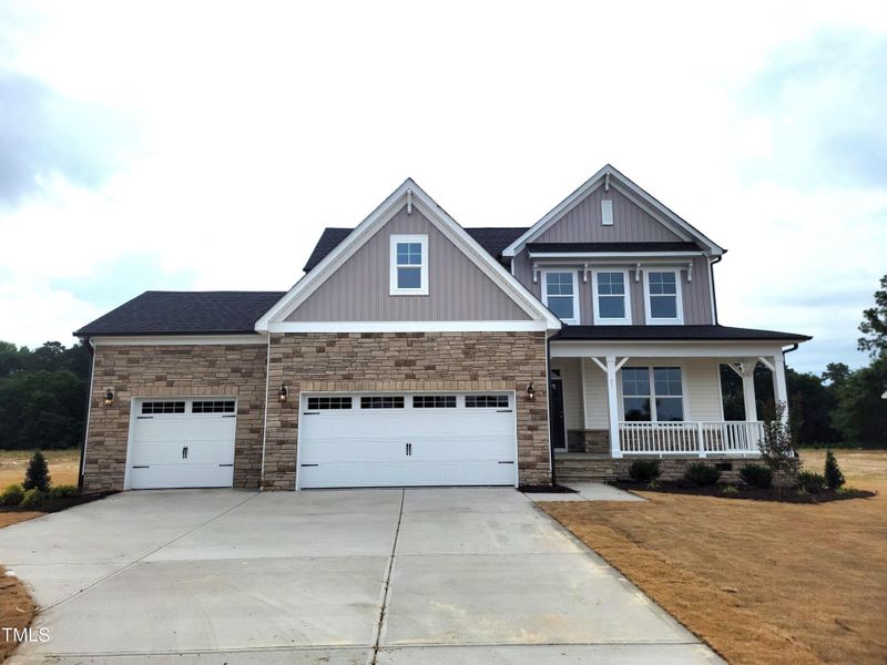 Front exterior of a new home in Tobacco Road, Angier, NC, highlighting curb appeal (Image 79). Front exterior of a new home in Tobacco Road, Angier, NC, highlighting curb appeal (Image 79).