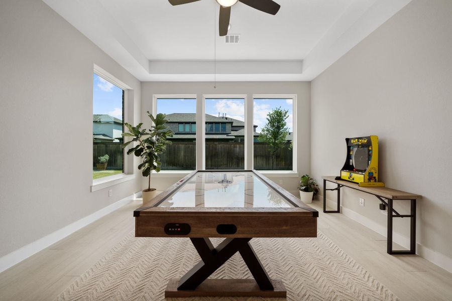 A ceiling fan ensures the space remains comfortable year-round, with a conveniently placed door leading directly to the back yard, while the neutral color palette allows for easy customization. A ceiling fan ensures the space remains comfortable year-round, with a conveniently placed door leading directly to the back yard, while the neutral color palette allows for easy customization.