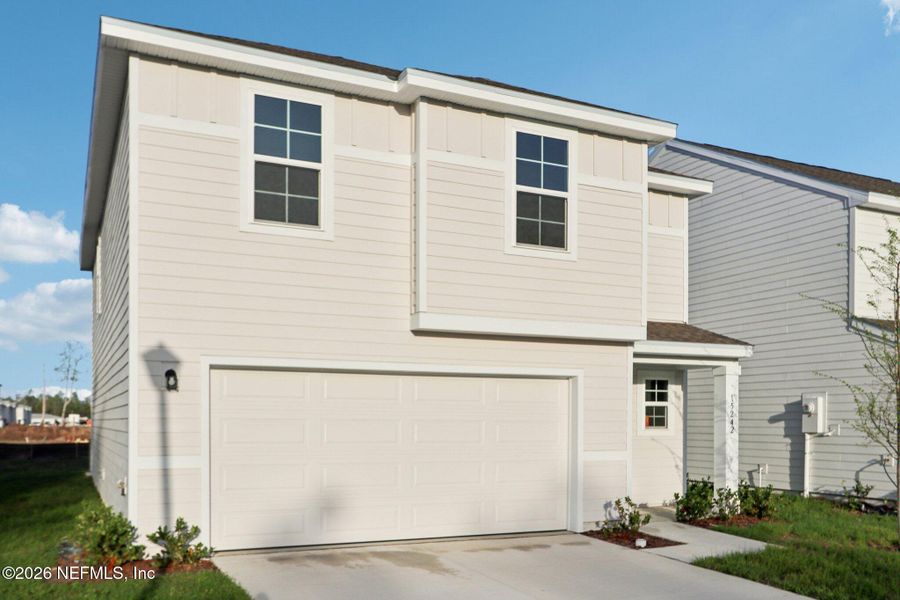 Front exterior of a new home in Park Grove, Jacksonville, FL, highlighting curb appeal (Image 17).