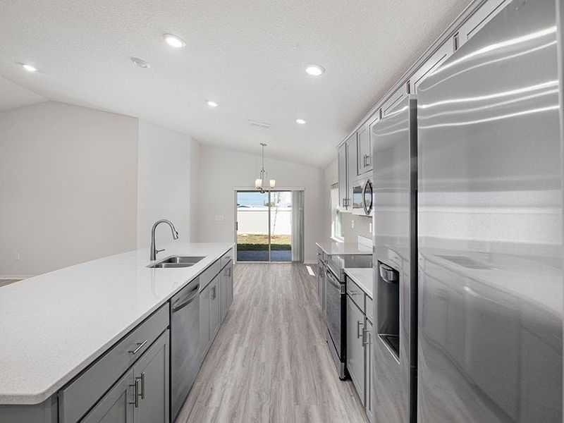 Your beautiful kitchen includes quartz, 36-inch cabinets, Samsung SS appliances, and dining at the island and adjacent cafe. Your beautiful kitchen includes quartz, 36-inch cabinets, Samsung SS appliances, and dining at the island and adjacent cafe.
