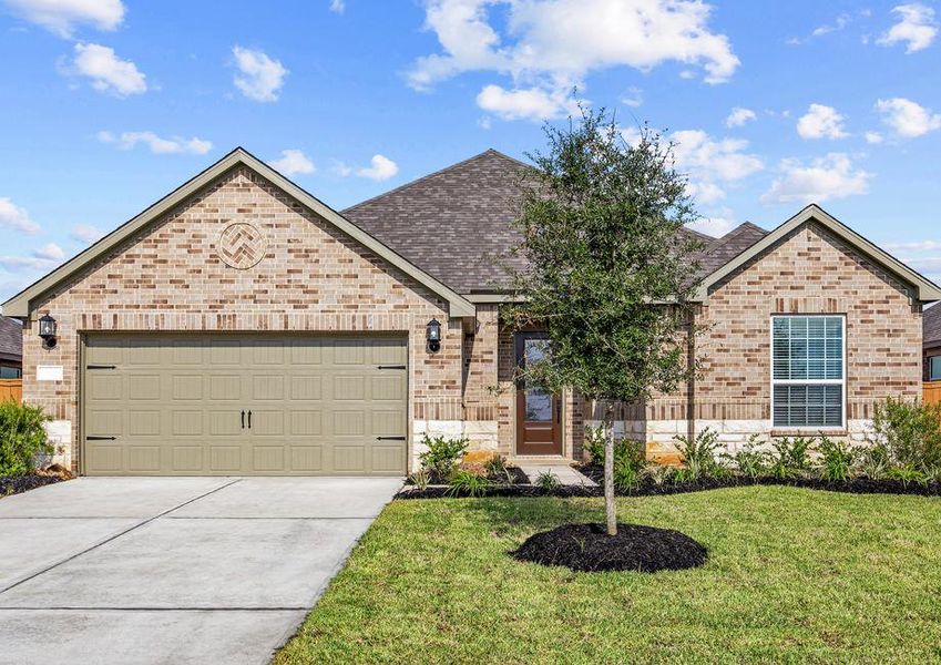 Beautiful single story home with brick and stone and front yard landscaping