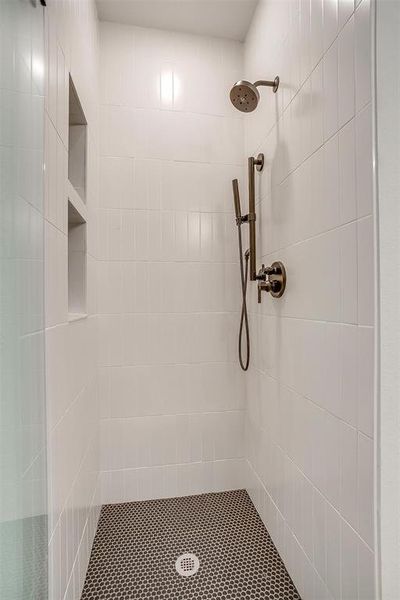 Bathroom with a tile shower