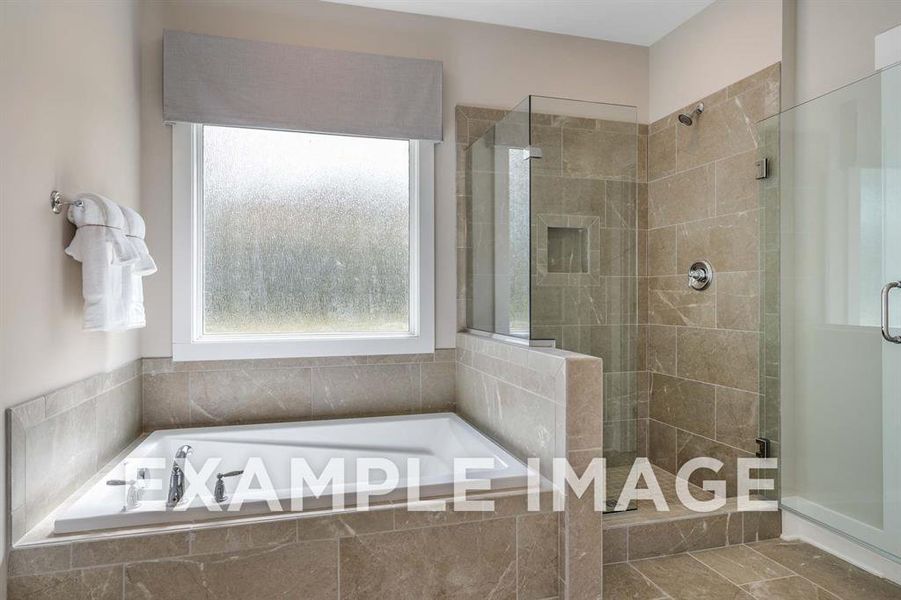 Bathroom featuring independent shower and bath