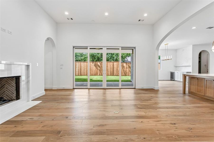 Marble-surround gas fireplace anchors the room