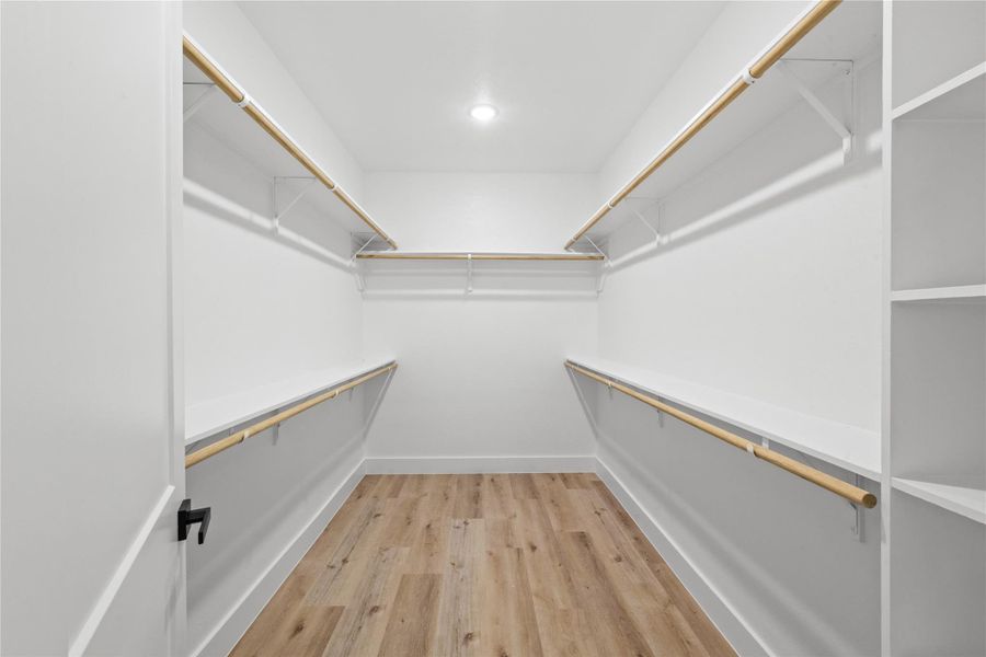 Walk in closet of primary suite