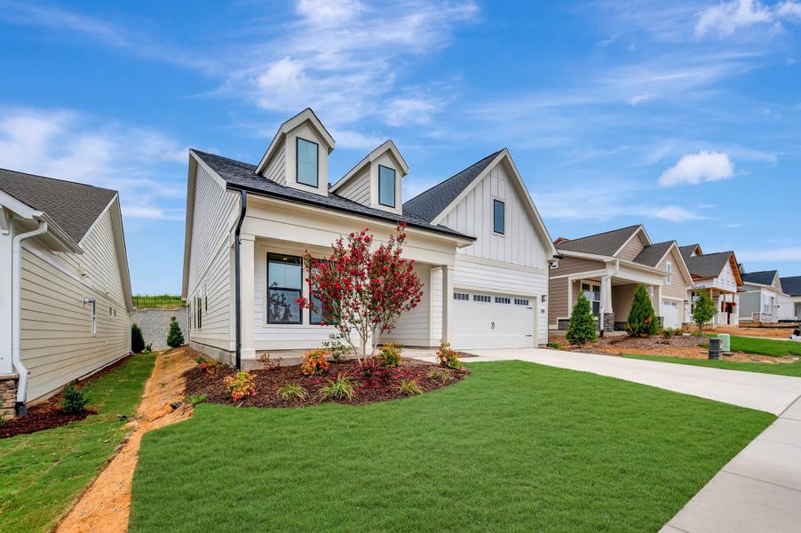 Front exterior of a new home in Altis At Serenity | A 55+ Community, Fuquay Varina, NC, highlighting curb appeal (Image 2). Front exterior of a new home in Altis At Serenity | A 55+ Community, Fuquay Varina, NC, highlighting curb appeal (Image 2).