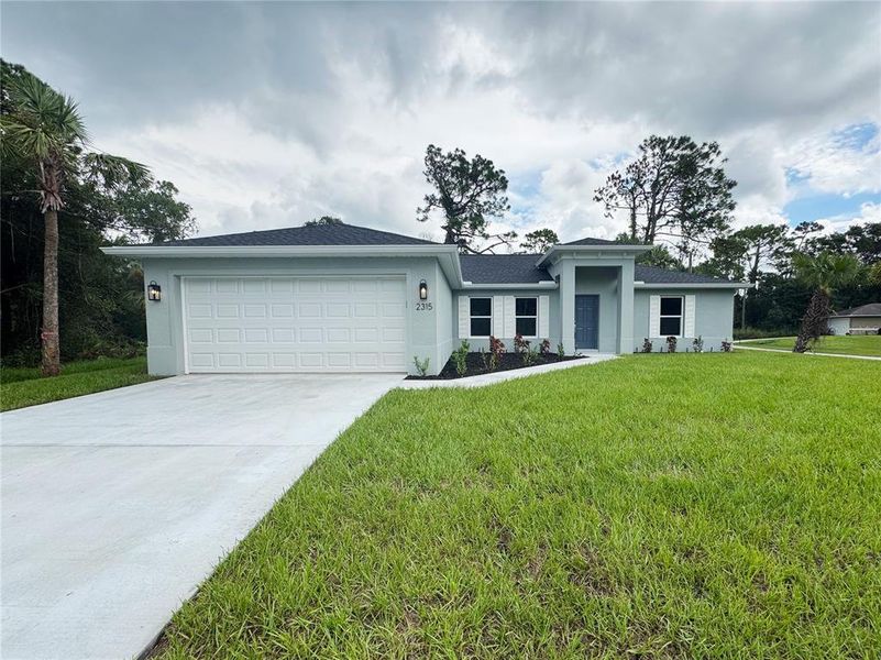 Front exterior of a new home in , North Port, FL, highlighting curb appeal (Image 1). Front exterior of a new home in , North Port, FL, highlighting curb appeal (Image 1).