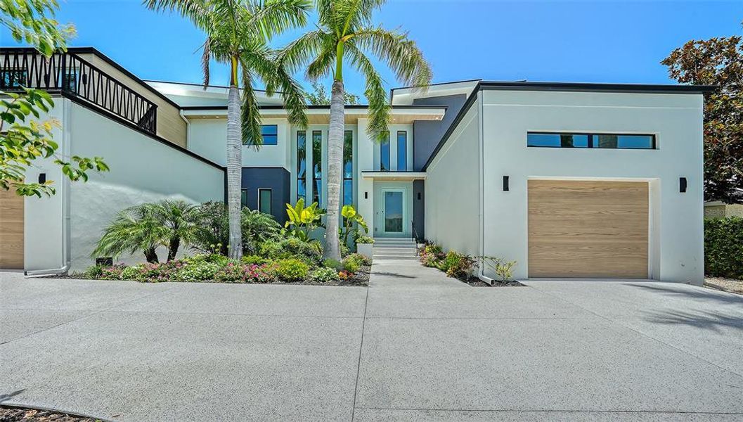 Front exterior of a new home in , Sarasota, FL, highlighting curb appeal (Image 29).
