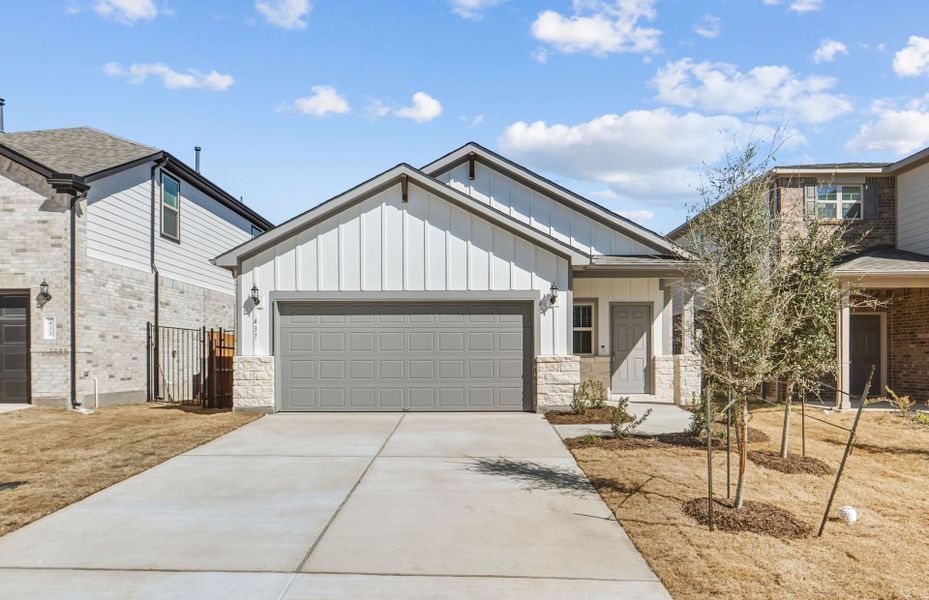 Front exterior of a new home in Saddleback at Santa Rita Ranch, Liberty Hill, TX, highlighting curb appeal (Image 21).