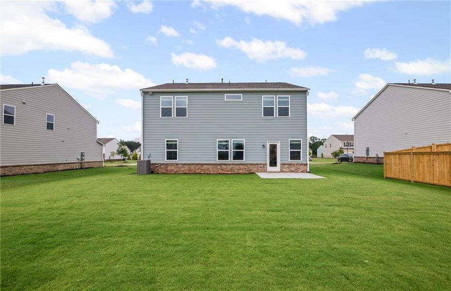 Front exterior of a new home in Anderson Point, McDonough, GA, highlighting curb appeal (Image 1).