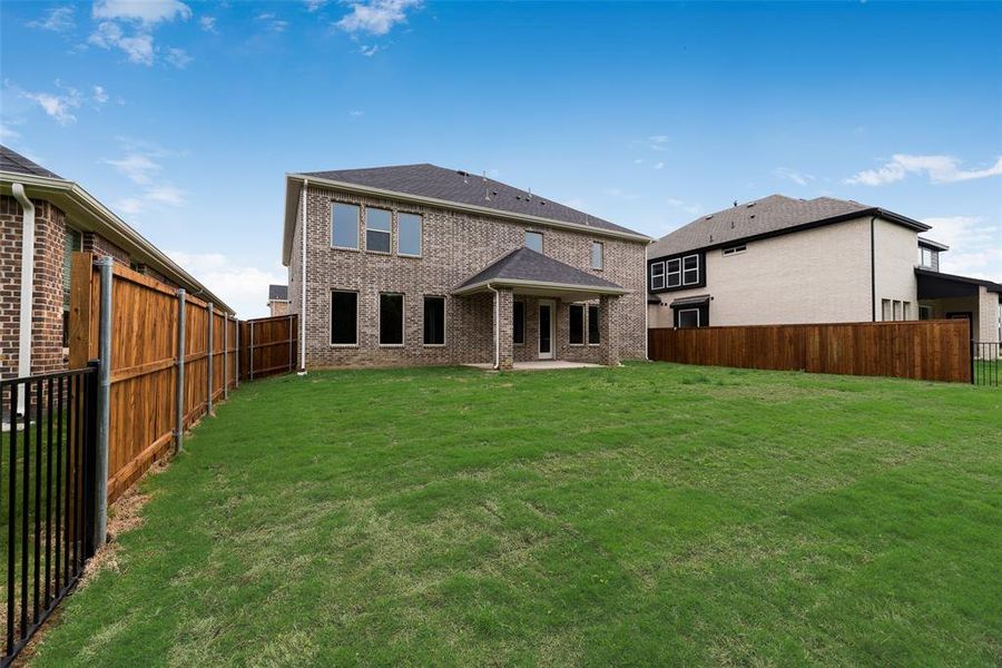 Front exterior of a new home in Valencia On The Lake, Little Elm, TX, highlighting curb appeal (Image 23). Front exterior of a new home in Valencia On The Lake, Little Elm, TX, highlighting curb appeal (Image 23).