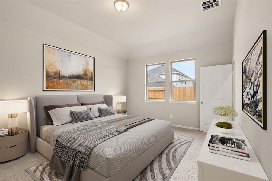 The primary bedroom is generously sized, creating a tranquil and spacious retreat that offers ample room for relaxation. Featuring plush carpet, high ceilings, fresh paint, and large windows that lets in natural lighting throughout the day.