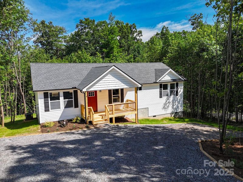 Front exterior of a new home in , Candler, NC, highlighting curb appeal (Image 19). Front exterior of a new home in , Candler, NC, highlighting curb appeal (Image 19).